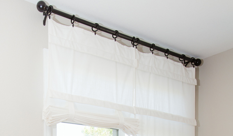 Tumble shades in Raleigh give your doors privacy versatility and style. White tumble shade on double glass doors